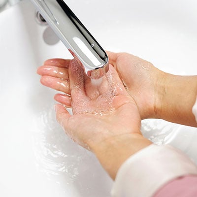 Wet hands with warm water