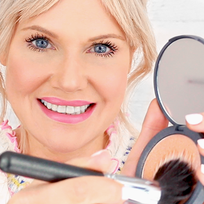 Take a big fluffy brush & swirl into the highlighter